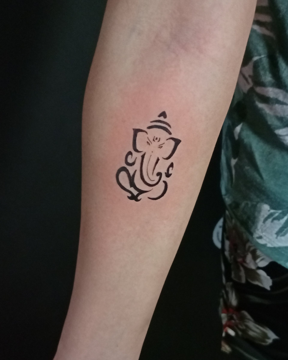 Anahata Ink Tattoo Kuta Bali - Small Ganesh Tattoo on the Arm