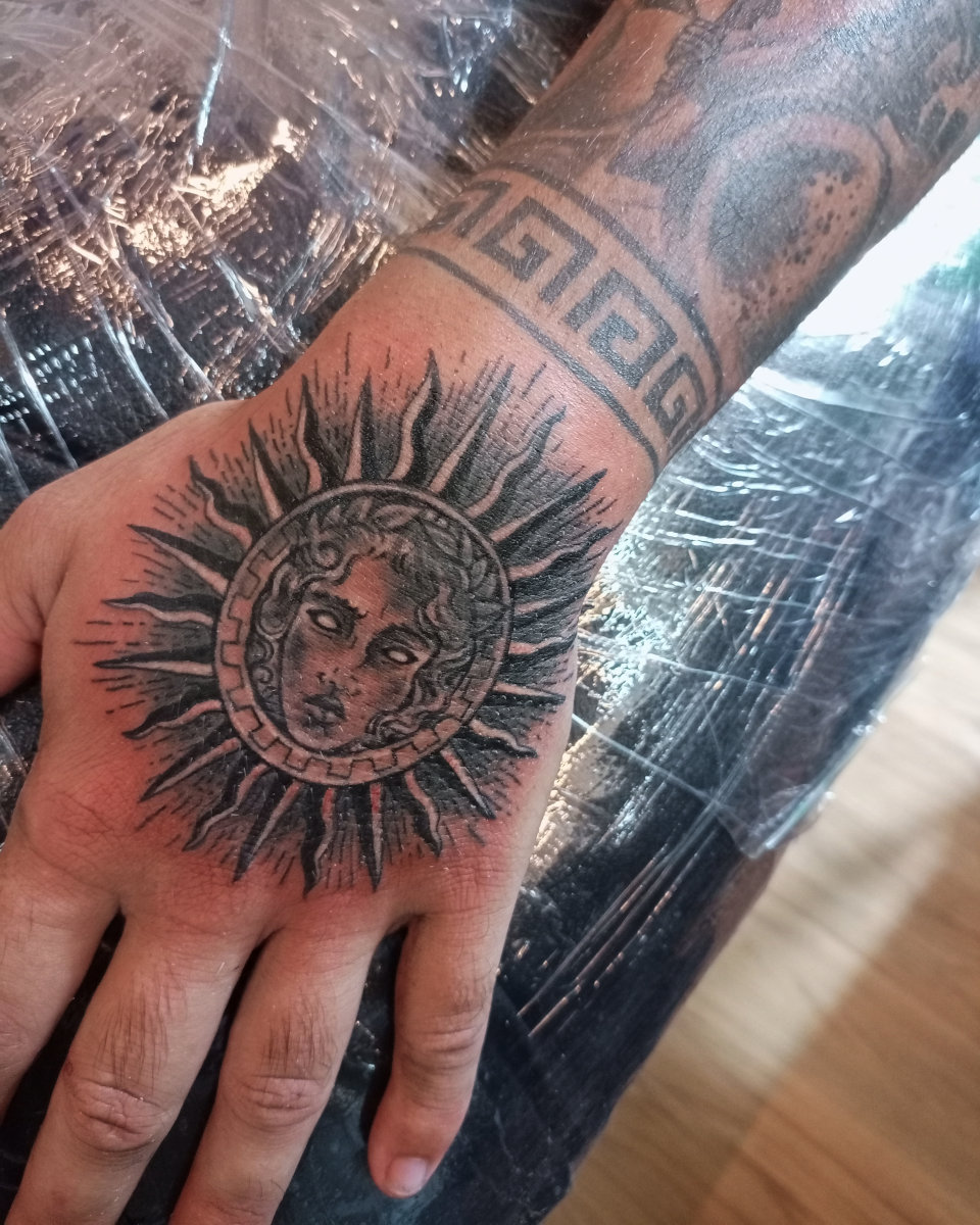 Anahata Ink Tattoo Kuta Bali - Sun God Wrist Tattoo