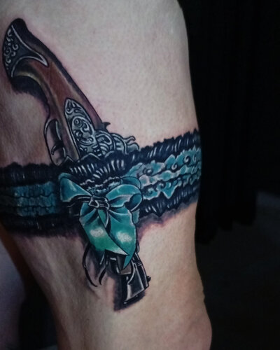 Anahata Ink Tattoo Kuta Bali - Ribbon and Gun tattoos